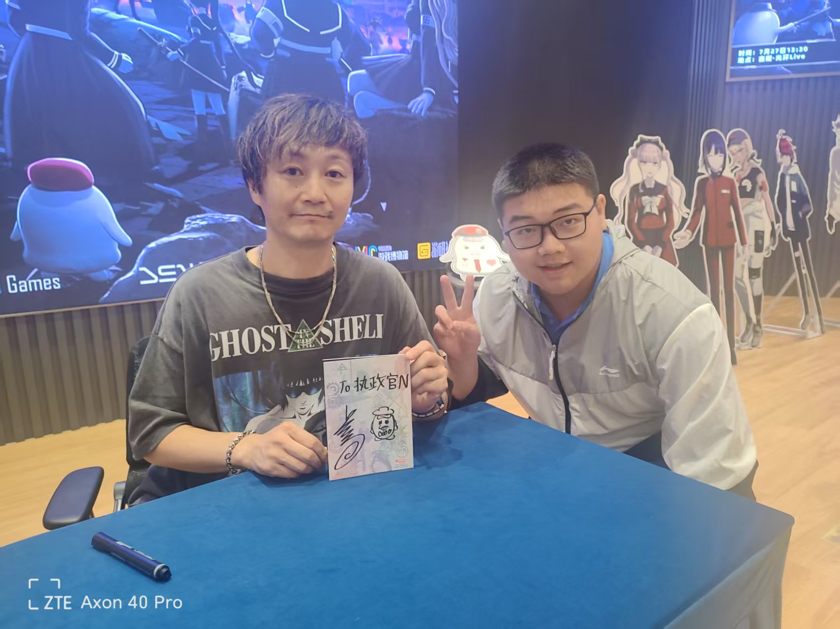 Chen Liang, on the right, posing for a photo at an event